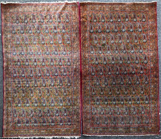 A pair of Kirman rugs, retailed by Liberty, 7ft 6in by 4ft 7in.